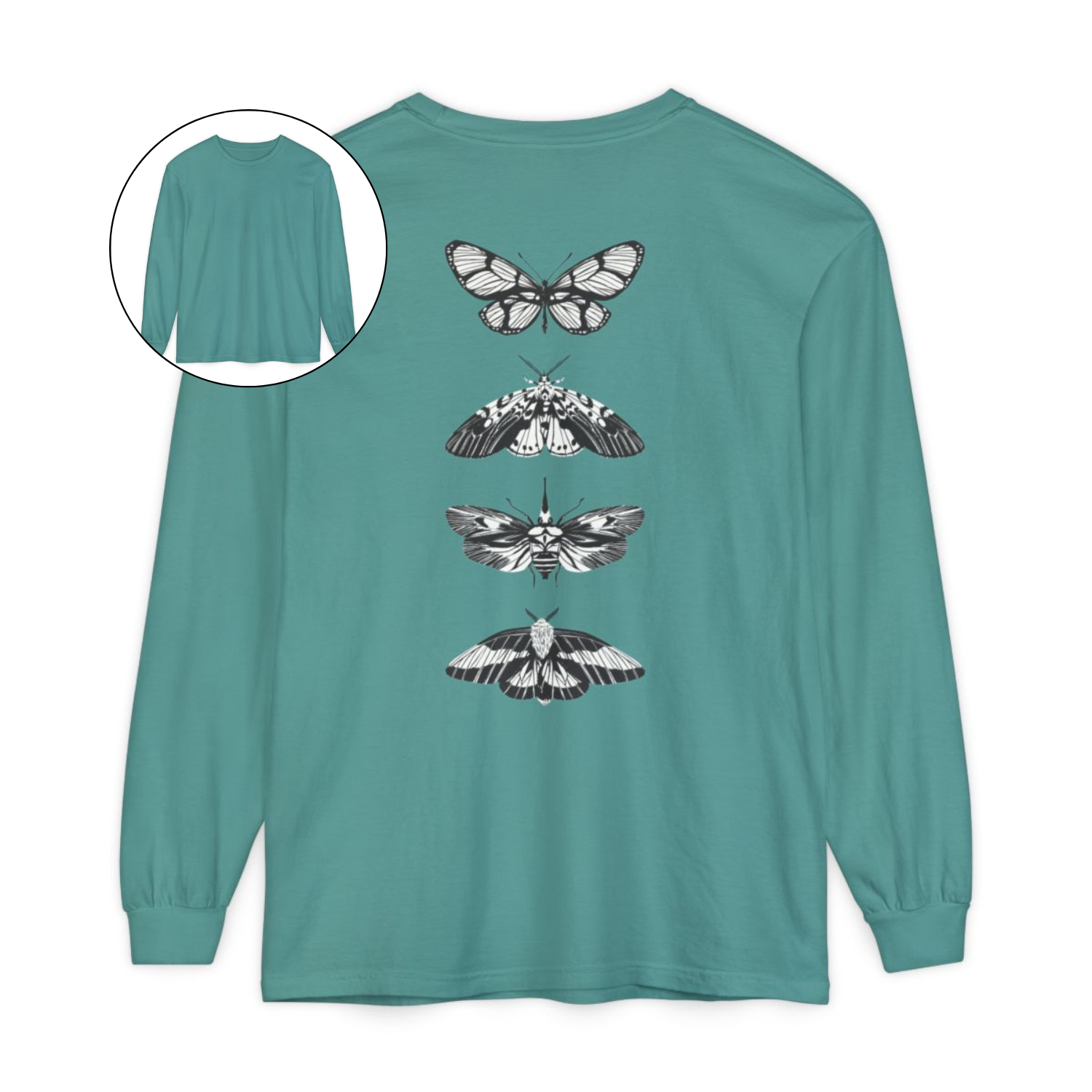 On the back of this long sleeve women's shirt right in between the shoulder blades is a row of black and white butterflies, starting at the top of the back and headed to the bottom of the shirt.