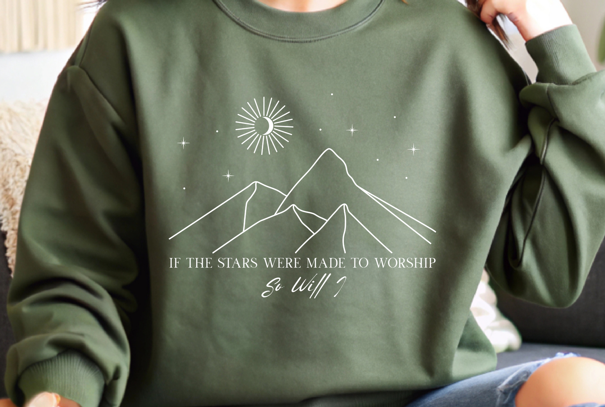 On the front of this Christian sweater is an image of mountains with a bunch of stars on the top, the words If the stars were made to worship So will i in two different fonts.