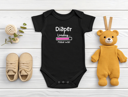 On the front of this custom infant onesie are the words Diaper loading please wait with an image of a battery life bar in pink.