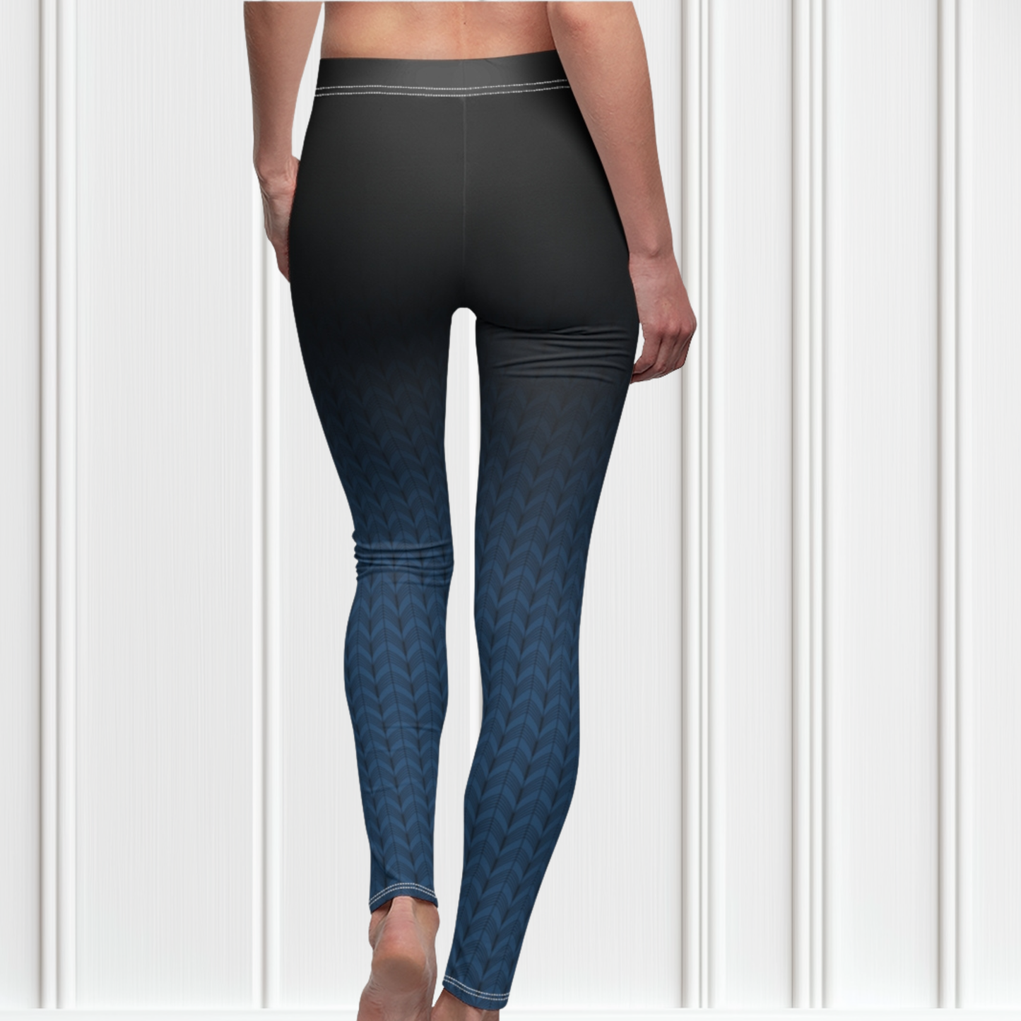 A pair of high waisted women's handmade custom leggings with a ombre pattern that starts as black at the waistline then shifts to a deep blue color at the bottom, there is a black wave pattern that is superimposed overtop and it blends into the black at the waistline.