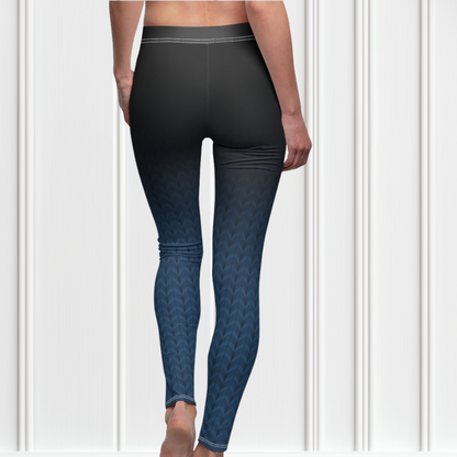 A pair of high waisted women's handmade custom leggings with a ombre pattern that starts as black at the waistline then shifts to a deep blue color at the bottom, there is a black wave pattern that is superimposed overtop and it blends into the black at the waistline.