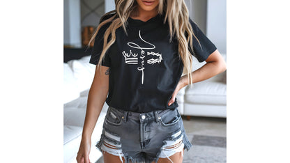 On the front of this custom Christian t-shirt is the name of Jesus in a cursive front from the top of the shirt facing towards the bottom, there is a crown on one side of the name and a crown of thorns on the other side of the name.
