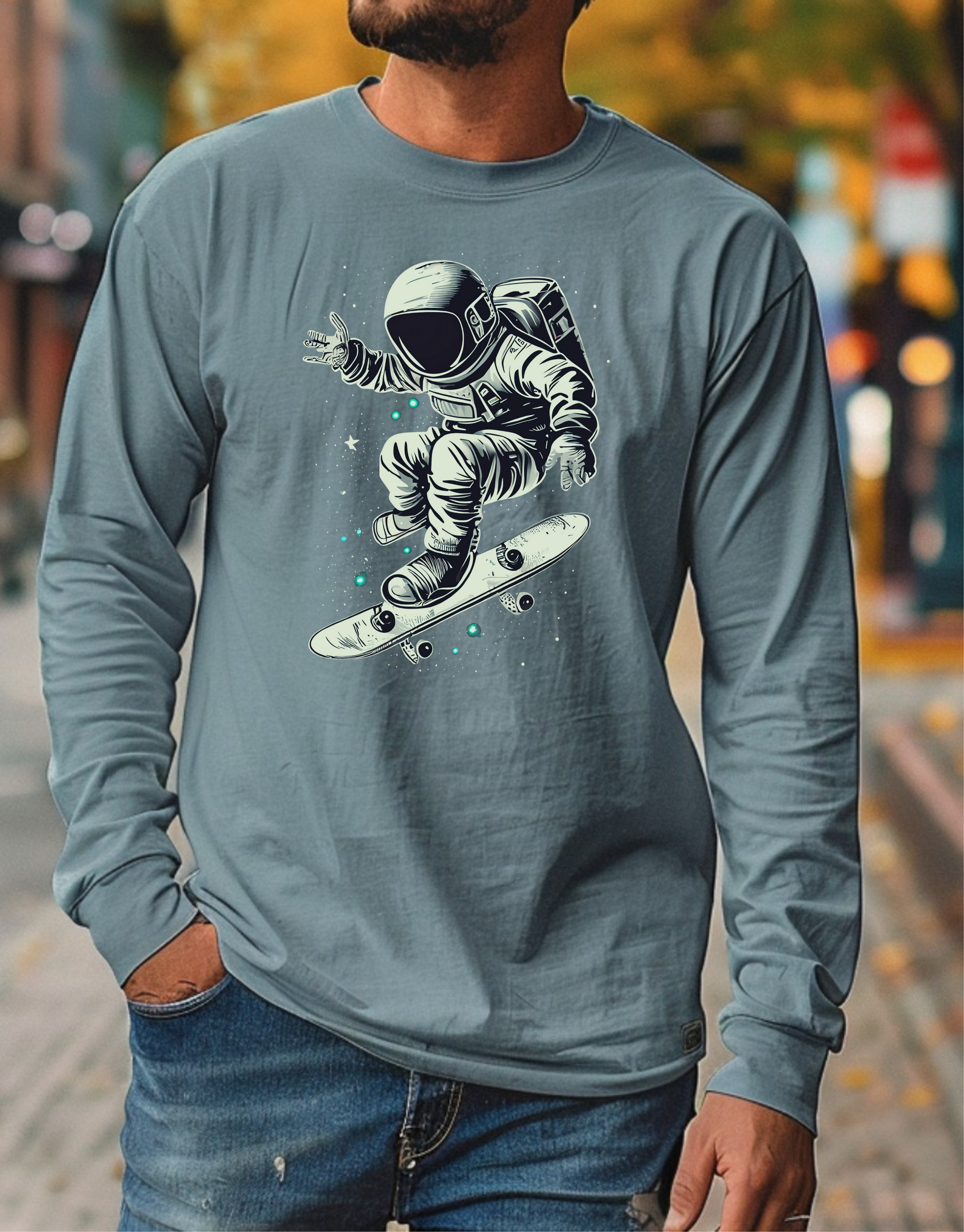 On the front of this custom unisex long sleeve shirt is an image of an astronaut riding a skateboard, there are a bunch of stars around the astronaut.