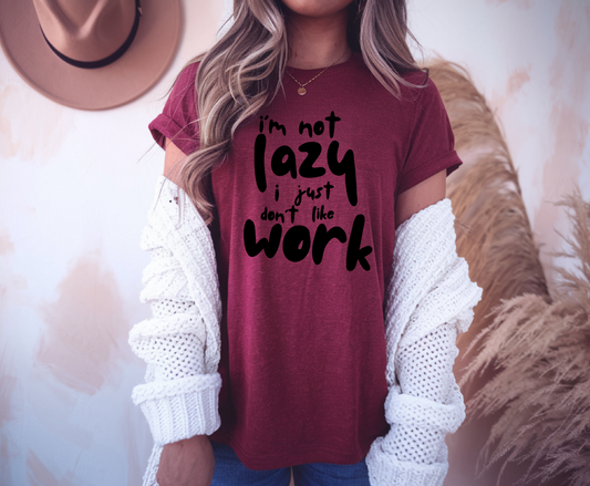 On the front of this custom short sleeve shirt in large bubble letters are the words I'm not lazy I just don't like work.