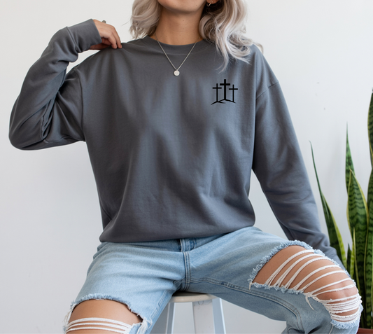 A classic Christian Unisex Ultra Cotton Long Sleeve Custom Tee featuring an image of three Jesus crosses on a hill on the top left chest of the shirt.