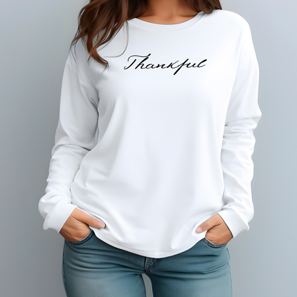 On the front of this custom unisex long sleeve t-shirt is the word thankful in a flowy cursive font.