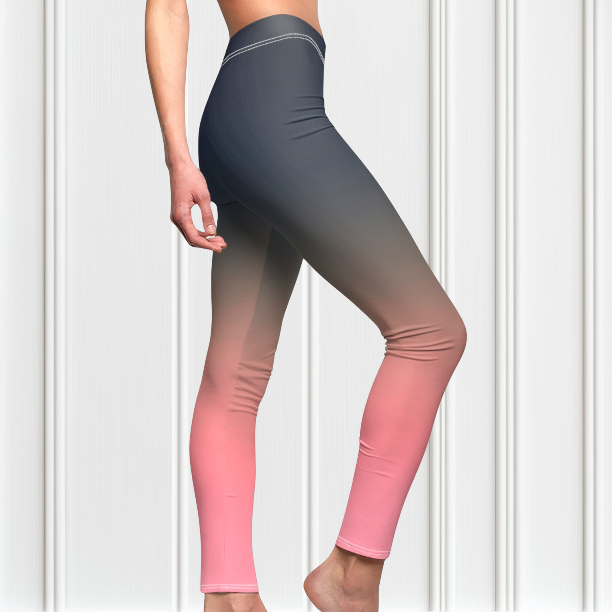 A pair of custom handmade high waisted women's leggings that have a ombre pattern that starts as navy blue at the top waistline of the leggings then fades to a light bubble gum pink at the ankles of the pants.