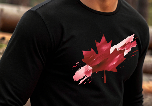 On the front of this unisex long sleeve shirt is an image of a Canadian maple leaf that is bright red, it looks like it has been spray painted onto the front of the shirt.