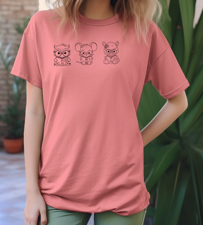 On the front of this custom women's shirt are three baby farm animals with the first being a baby owl then a baby mouse and the last one is a baby lamb, all three of the animals have glasses on and are reading books.