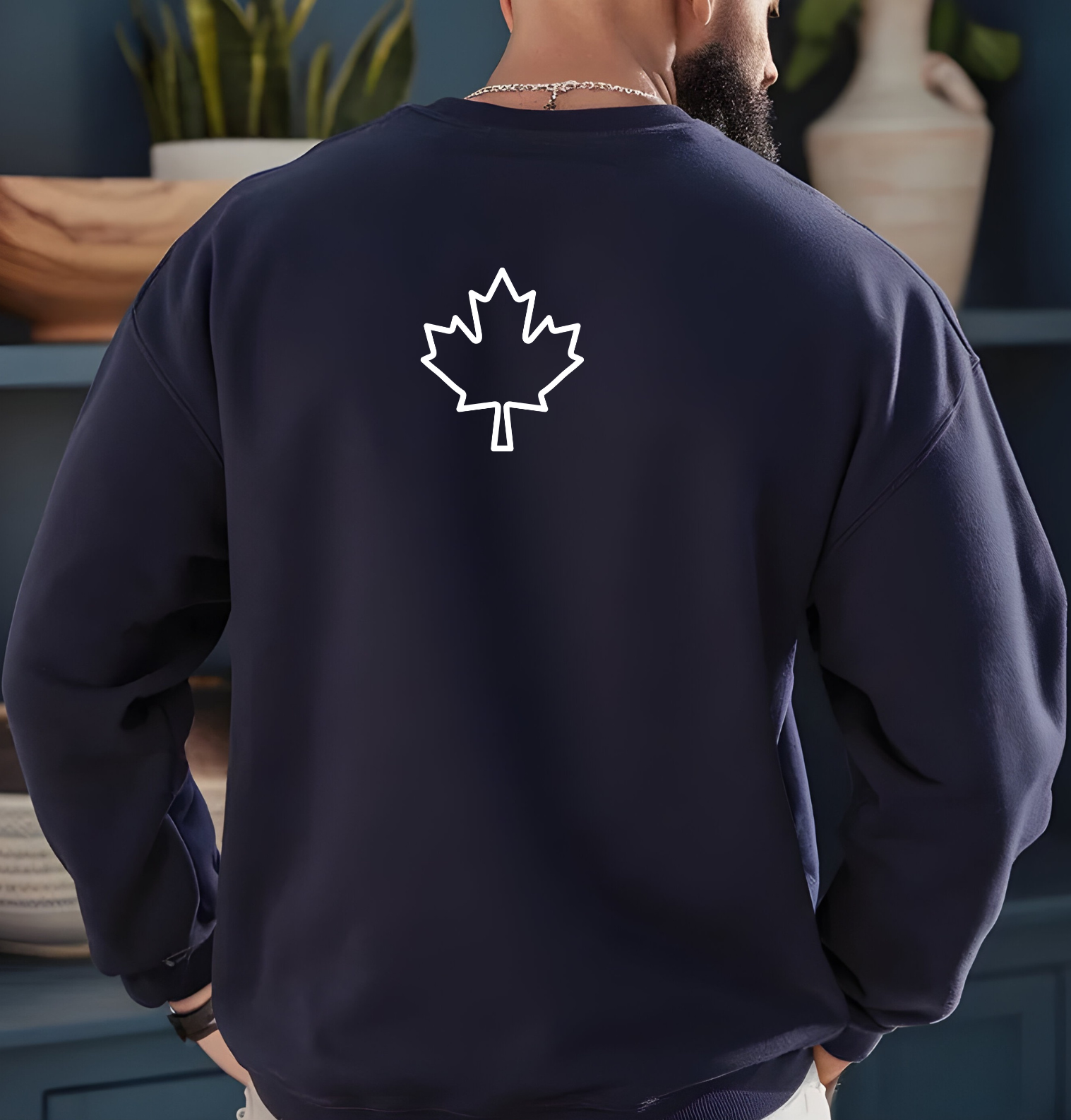 On the back of this custom Canadian pullover sweatshirt is a maple leaf that is right in between the shoulder blades, the front of the sweater is blank.