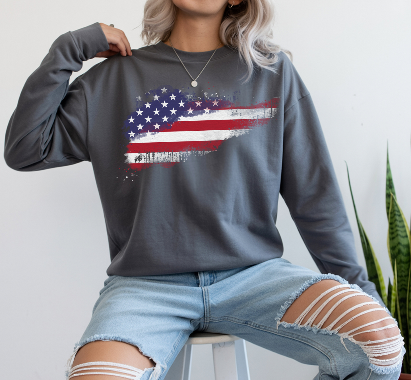 On the front of this super soft unisex long sleeve t-shirt is a vintage image of the United States of America Flag that looks like it has been scratched onto the shirt, this long sleeve tee is perfect for the 4th of July and patriotic individuals.