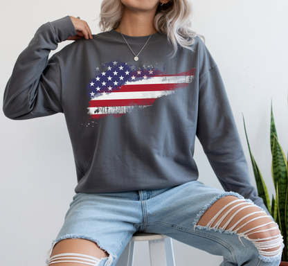 On the front of this super soft unisex long sleeve t-shirt is a vintage image of the United States of America Flag that looks like it has been scratched onto the shirt, this long sleeve tee is perfect for the 4th of July and patriotic individuals.