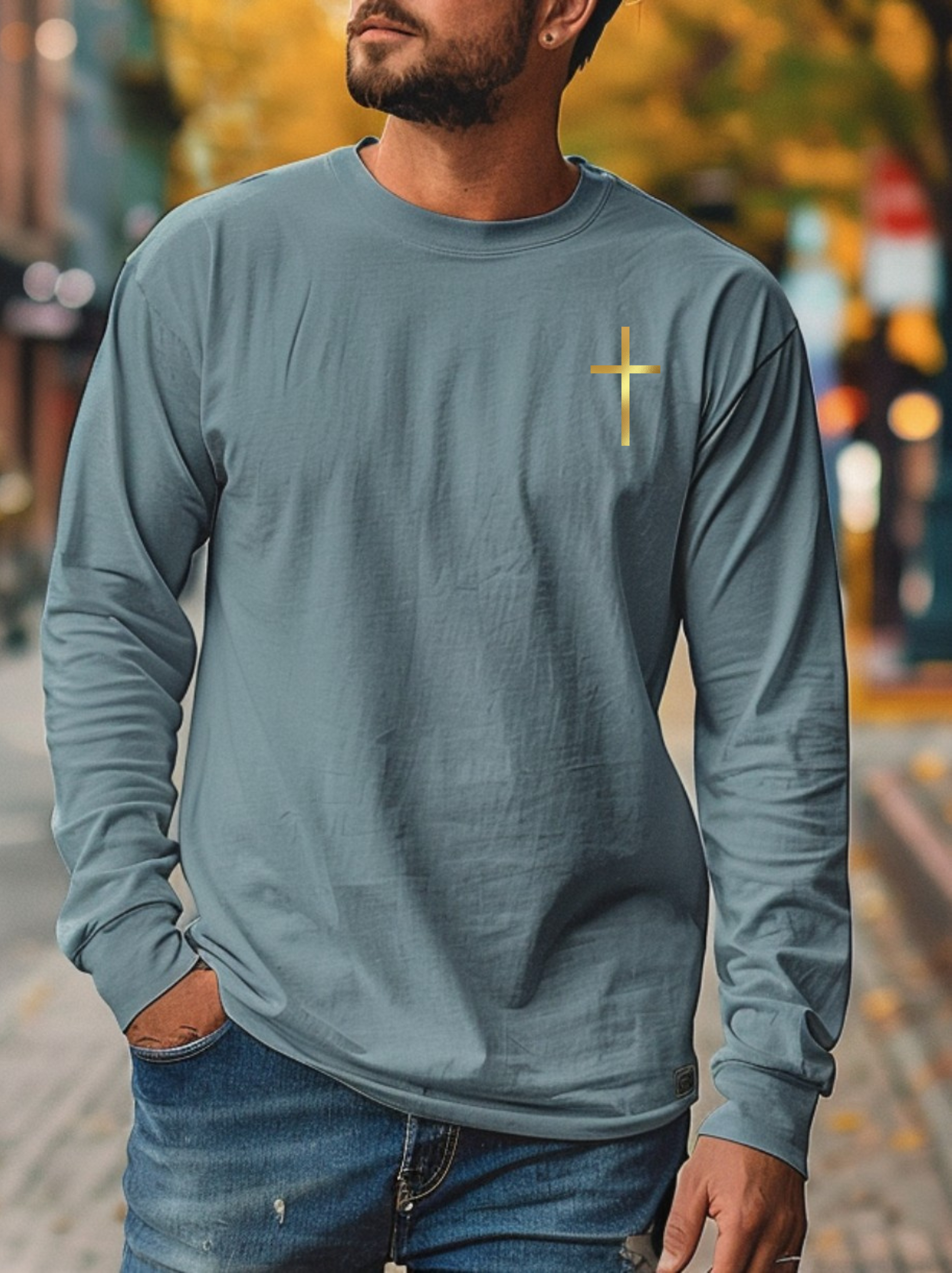 On the front of this custom Christian long sleeve shirt is a gold cross over the top left chest of the shirt.