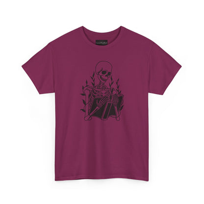 On the front of this custom unisex short sleeve shirt is a large image of a skeleton reading a book, there are vines with leaves on them behind the skeleton.