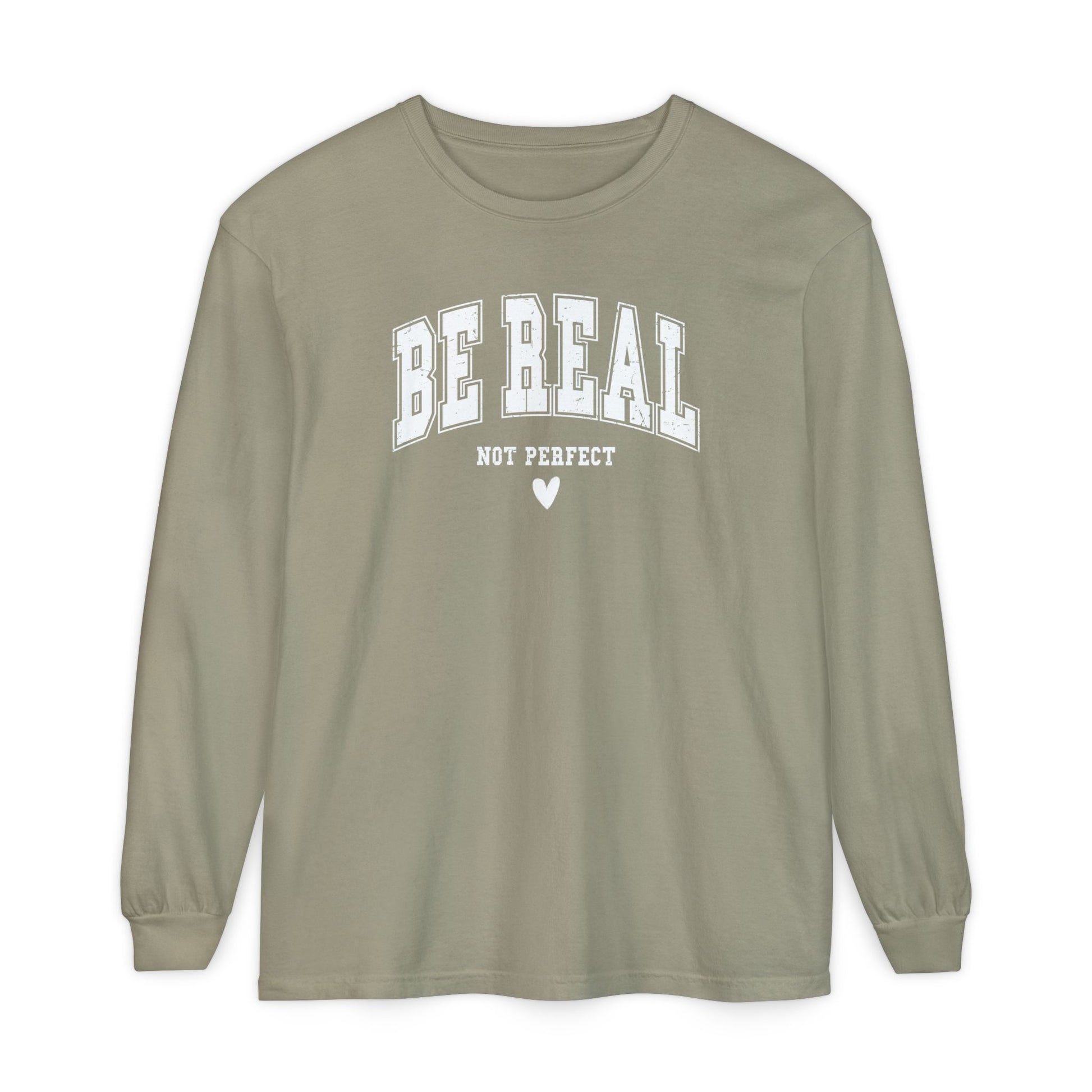 On the front of this custom unisex long sleeve shirt are the words Be Real in large bubble font with the words not perfect underneath the bubble letters, on the bottom there is a heart.