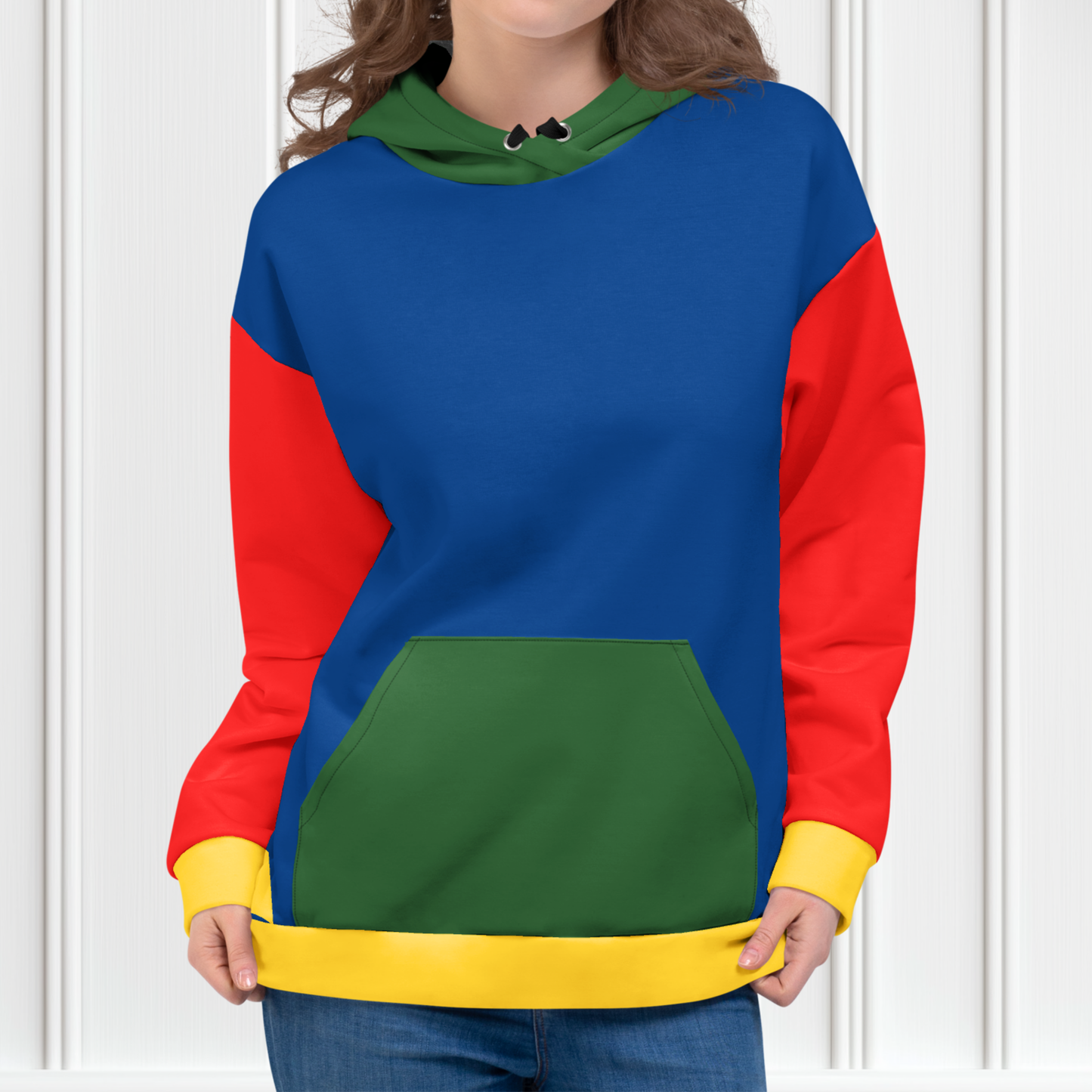 A custom hand sewn hoodie that has a color block design with the front and the back of the hoodie being a bright blue color, the front pocket and the outside of the hood are green, the inside of the hood and the sleeves are red in color with the cuffs of the sleeves and the waistband being a bright yellow color.