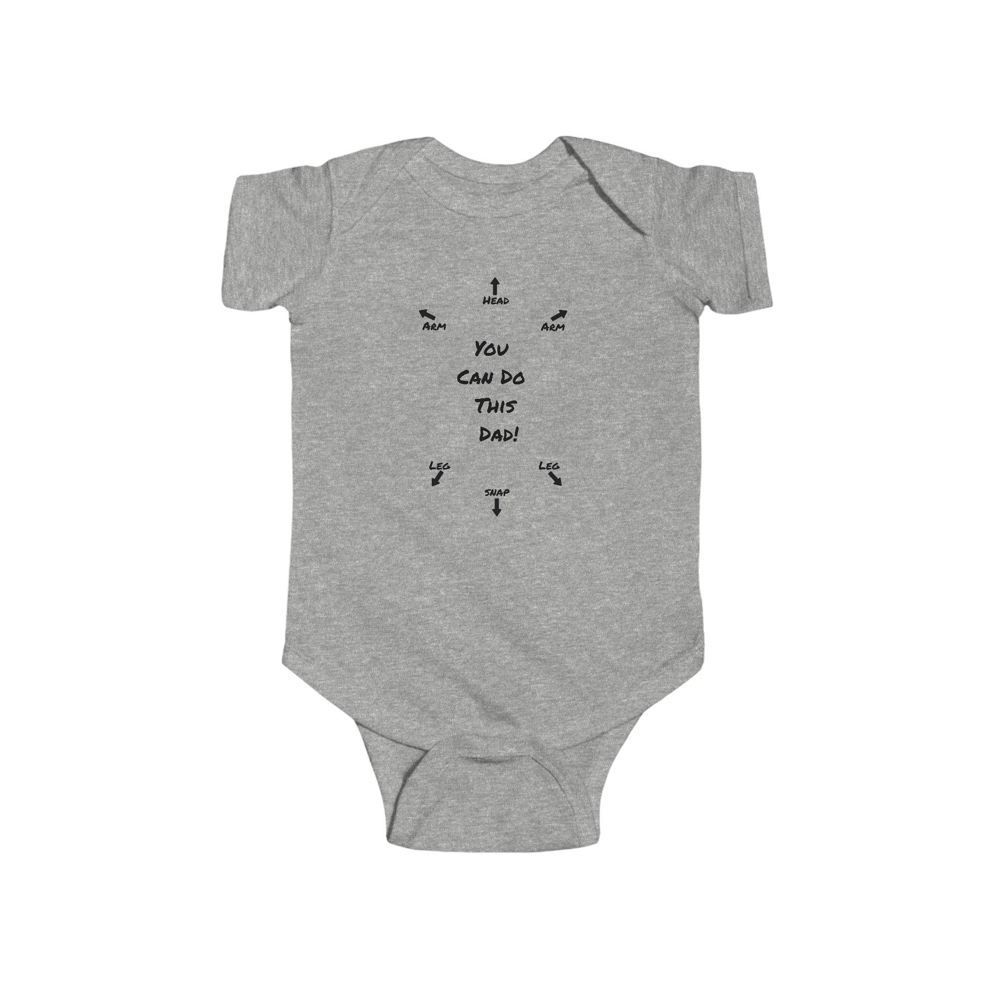 on the front of this custom infant onesie specifically meant for dads, are the words You can do this dad with arrows pointing where each leg and each arm goes along with were the babies head goes and where to close the snaps, a perfect diagram for a new father on how to put a onesie on a baby.