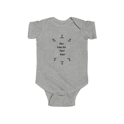 on the front of this custom infant onesie specifically meant for dads, are the words You can do this dad with arrows pointing where each leg and each arm goes along with were the babies head goes and where to close the snaps, a perfect diagram for a new father on how to put a onesie on a baby.