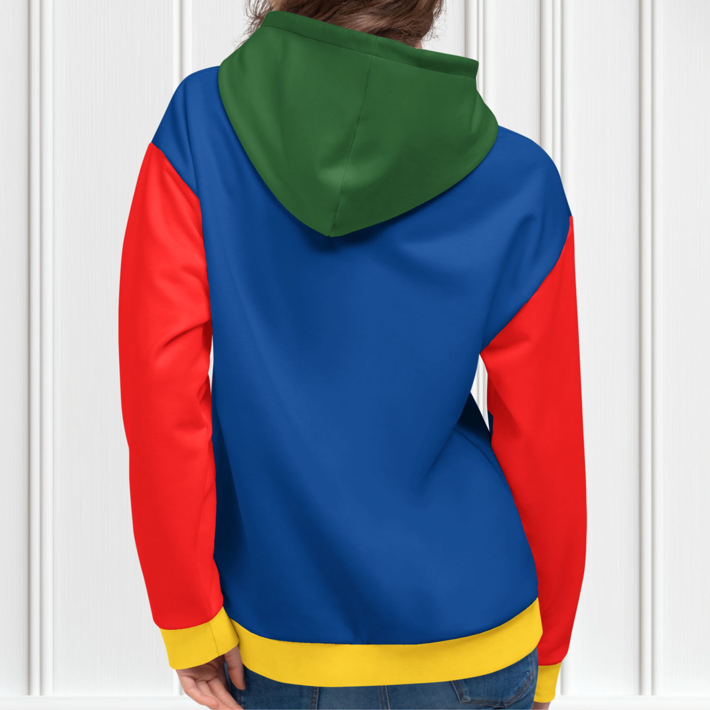 A custom hand sewn hoodie that has a color block design with the front and the back of the hoodie being a bright blue color, the front pocket and the outside of the hood are green, the inside of the hood and the sleeves are red in color with the cuffs of the sleeves and the waistband being a bright yellow color.