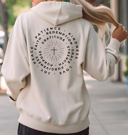 This custom Christian hoodie features a unique design on the back with a centered cross surrounded by circles of words such as Gratitude, Redemption, Patience, Joy, Love, Kindness, Peace, Faith, Forgiveness, Grace, Purpose and Strength.