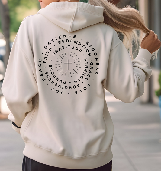 This custom Christian hoodie features a unique design on the back with a centered cross surrounded by circles of words such as Gratitude, Redemption, Patience, Joy, Love, Kindness, Peace, Faith, Forgiveness, Grace, Purpose and Strength.
