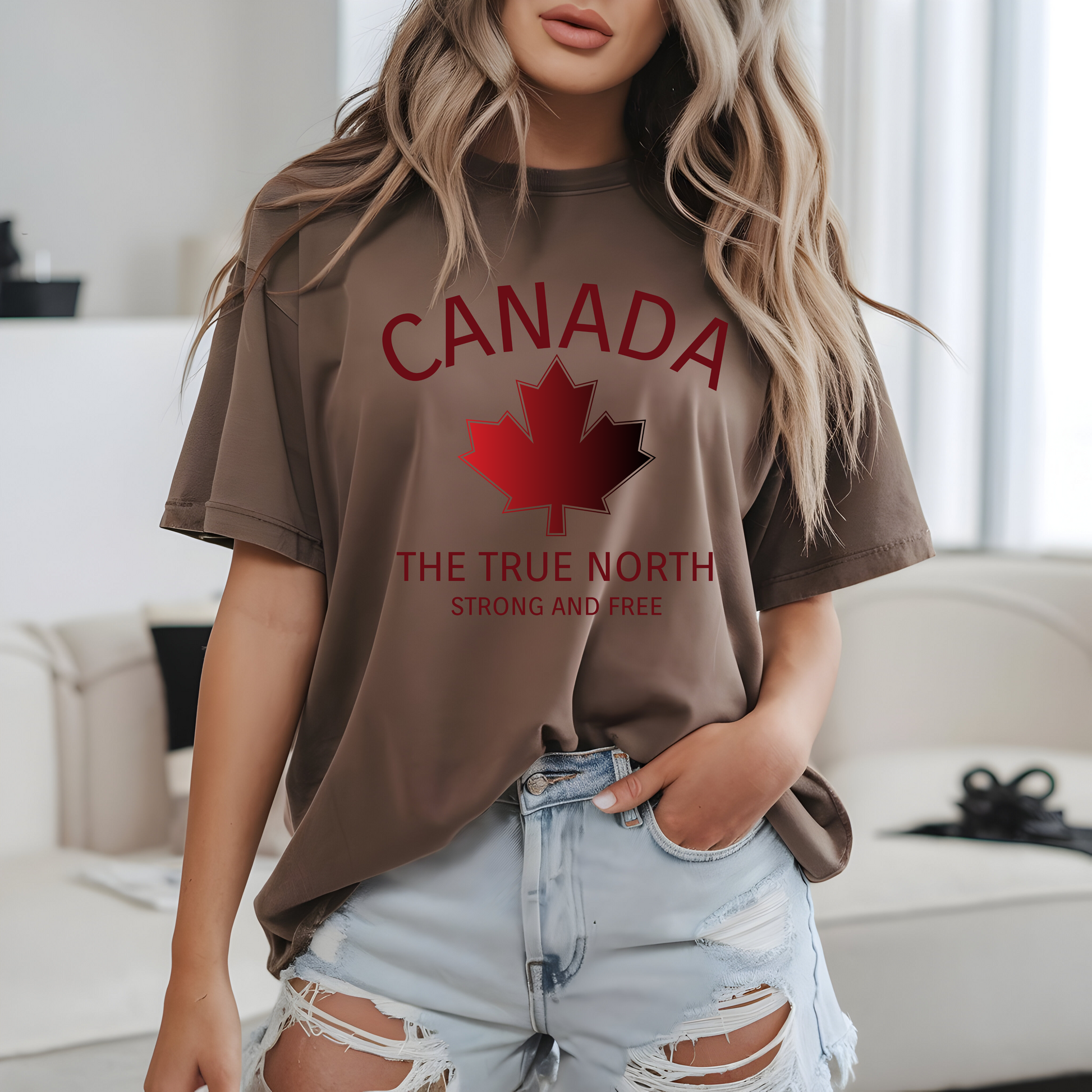 This custom Canadian made unisex custom t-shirt features the words Canada and The true North Strong And Free along with a maple leaf design in red, giving off a patriotic and Canadian vibe.