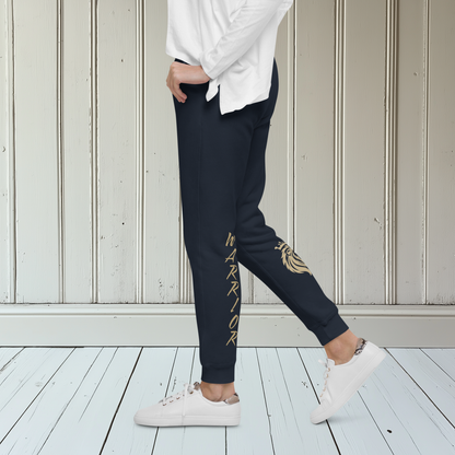 A pair of super soft ankle length unisex sweatpants, there are two pockets on the front and one pocket on the back right, the word warrior is in gold on the back left leg from the knee down and a male lion with a crown on the other