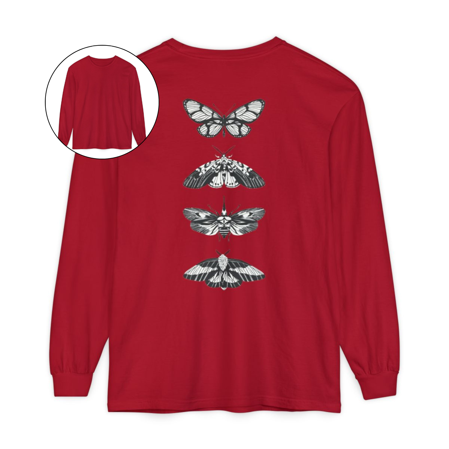On the back of this long sleeve women's shirt right in between the shoulder blades is a row of black and white butterflies, starting at the top of the back and headed to the bottom of the shirt.