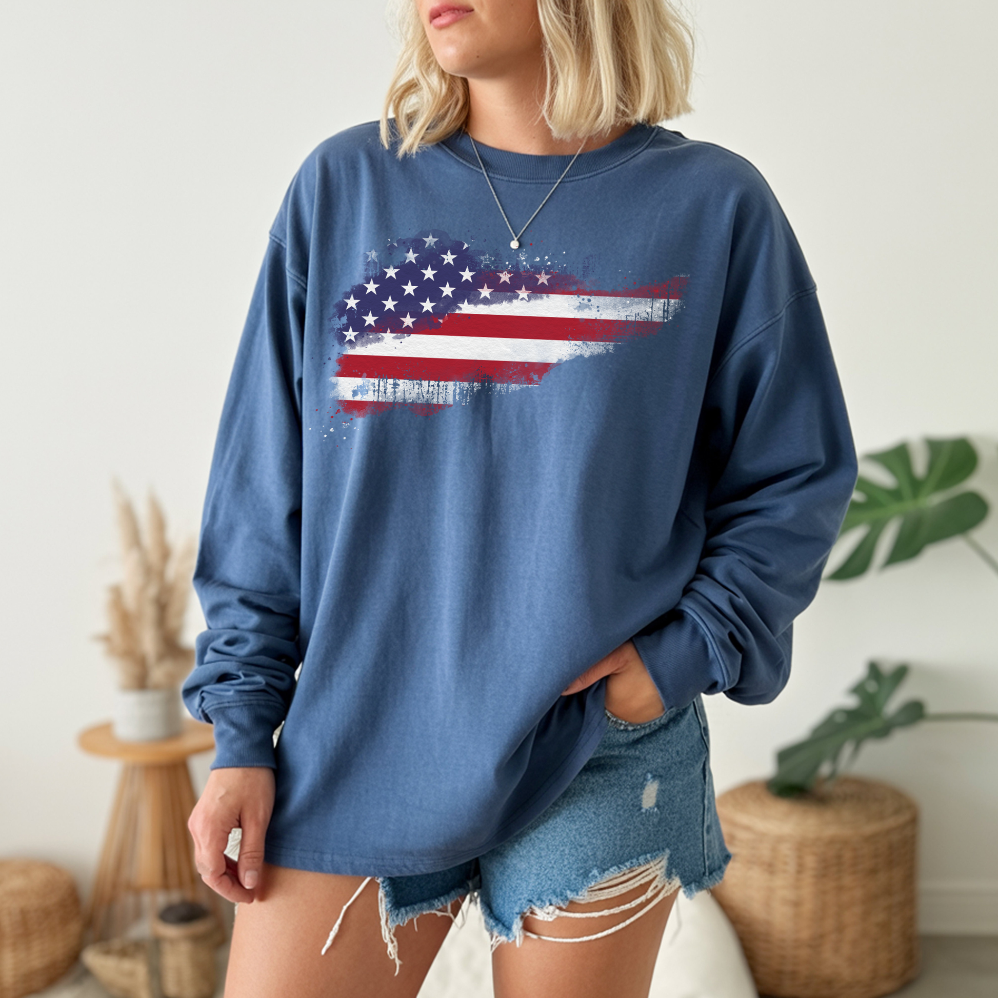 On the front of this super soft unisex long sleeve t-shirt is a vintage image of the United States of America Flag that looks like it has been scratched onto the shirt, this long sleeve tee is perfect for the 4th of July and patriotic individuals.