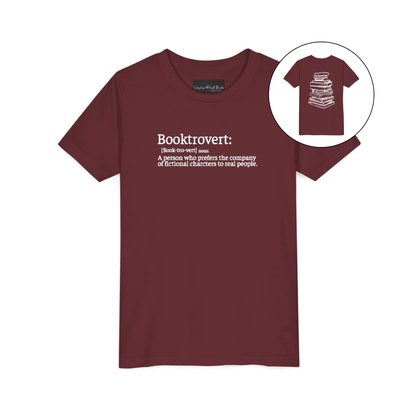 On the front of this custom youth t-shirt it says the word Booktrovert in large letter with the meaning of the words underneath it, on the back of the shirt is an image of a large stack of books.