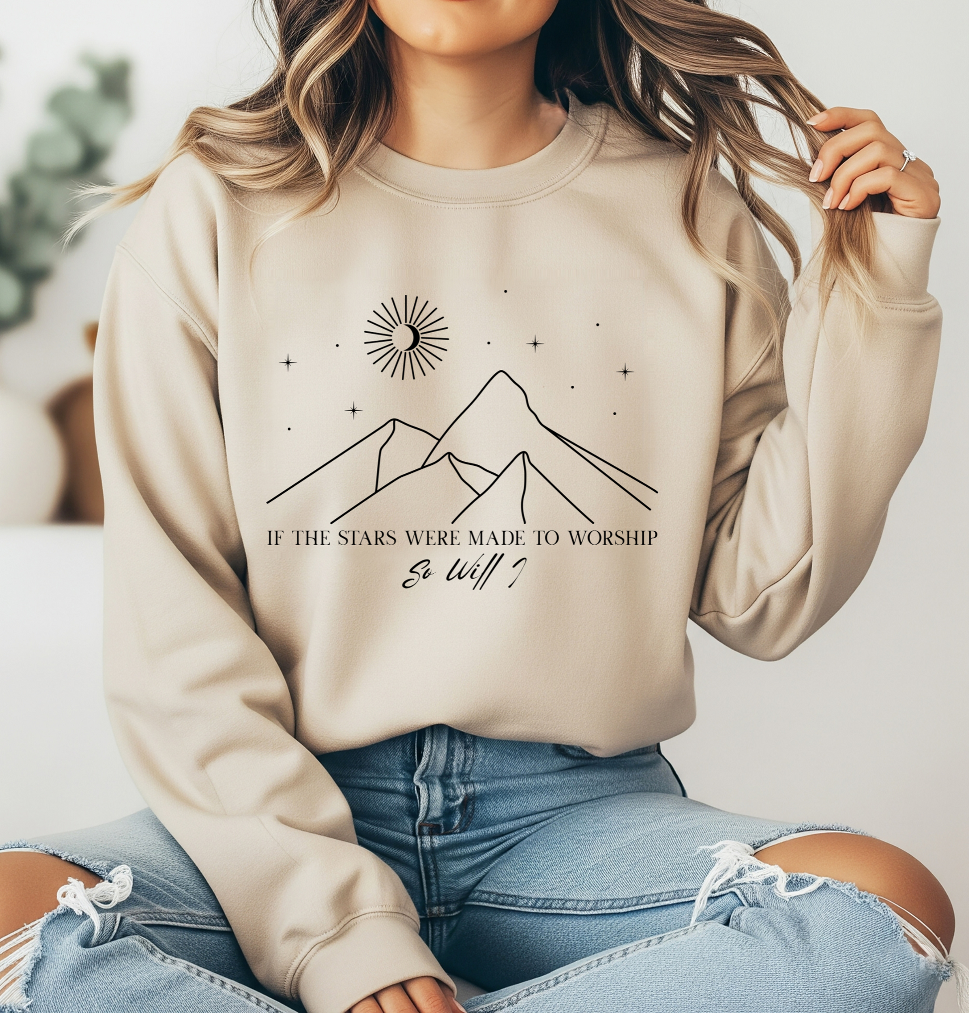 On the front of this Christian sweater is an image of mountains with a bunch of stars on the top, the words If the stars were made to worship So will i in two different fonts.