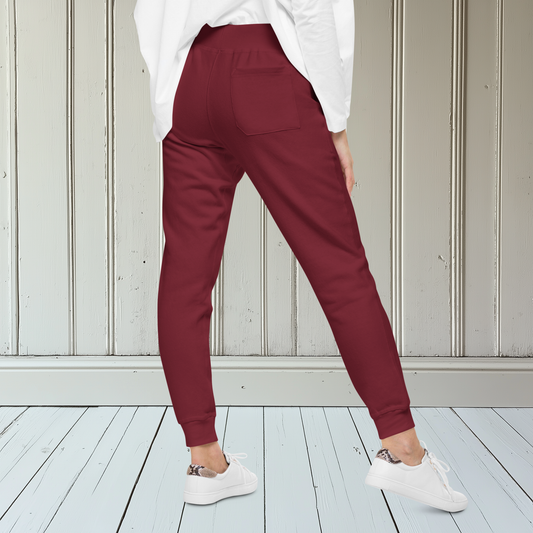 A pair of super soft fleece unisex sweatpants with a bumble bee embroidered in gold over the left front pocket of the pants.