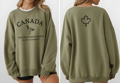 On the front of this unisex super soft Canadian sweatshirt is the word Canada in large text on the top with an image of a Canadian Goose underneath. Under the Goose are the words The Great White North with Canada's geological location under that.
