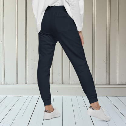 A pair of super soft ankle length unisex Christian sweatpants, there are two pockets on the front and one pocket on the back right, on the front left pocket  there is an embroidered dove with a fig leaf in silver thread.