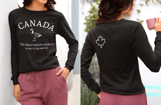 This custom Canadian made unisex long sleeve t-shirt features a Canadian goose on the front in the center of the shirt with the words 'Canada'  above it and 'The Great White North' under the goose, on the back left shoulder blade of the long sleeve shirt is a maple leaf.