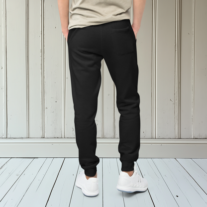 A pair of super soft ankle length Christian unisex sweatpants, there are two pockets on the front and one pocket on the back right, on the front left pocket is a embroidered white cross.