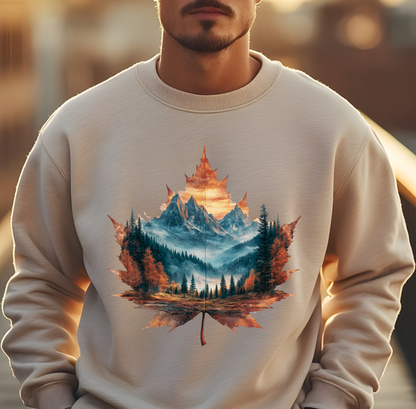 On the front of this Canadian pride sweatshirt is a large maple leaf with the inside of the leaf having a picture of the Rocky Mountains in the fall time.