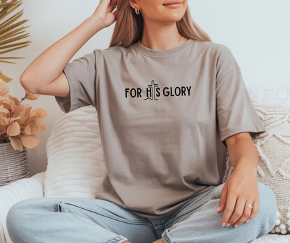 On the front of this super soft Christian unisex short sleeve shirt it says For His Glory with the letter I in the word His being a Jesus Cross.
