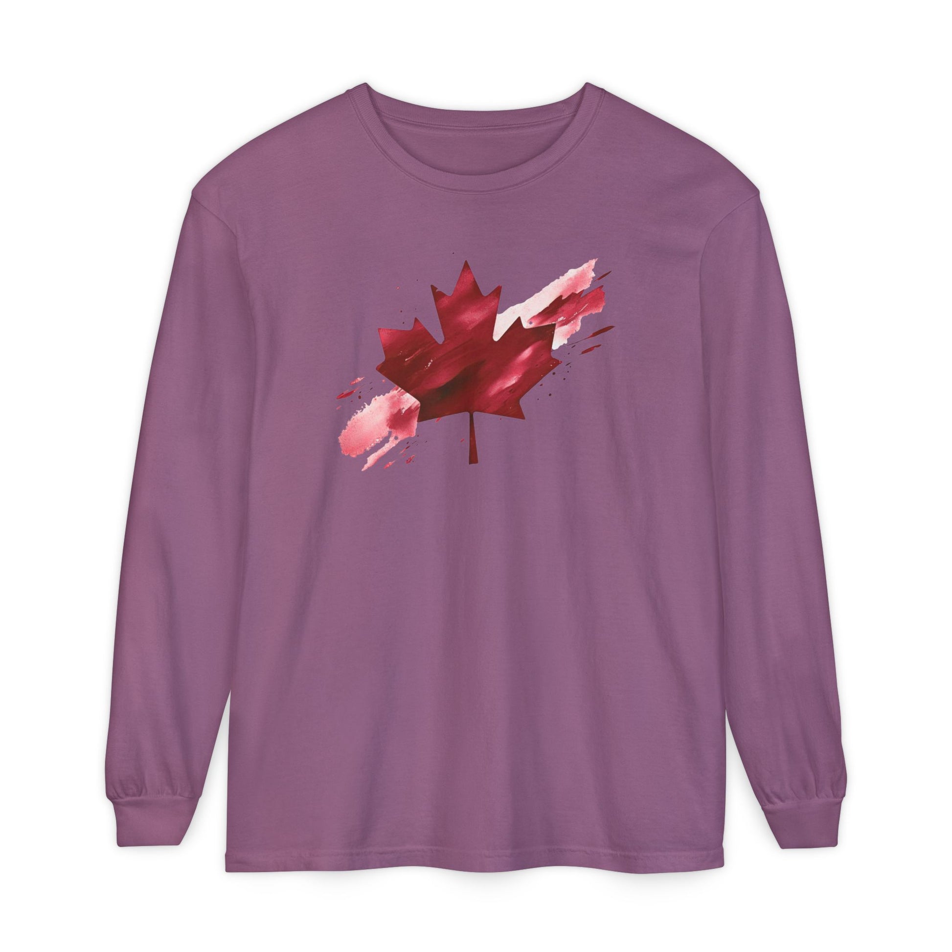 On the front of this unisex long sleeve shirt is an image of a Canadian maple leaf that is bright red, it looks like it has been spray painted onto the front of the shirt.