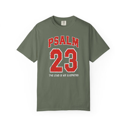 On the front side of this custom vintage t-shirt are the words Psalm 23 The Lord Is My Shepherd, it is with red and white block lettering.