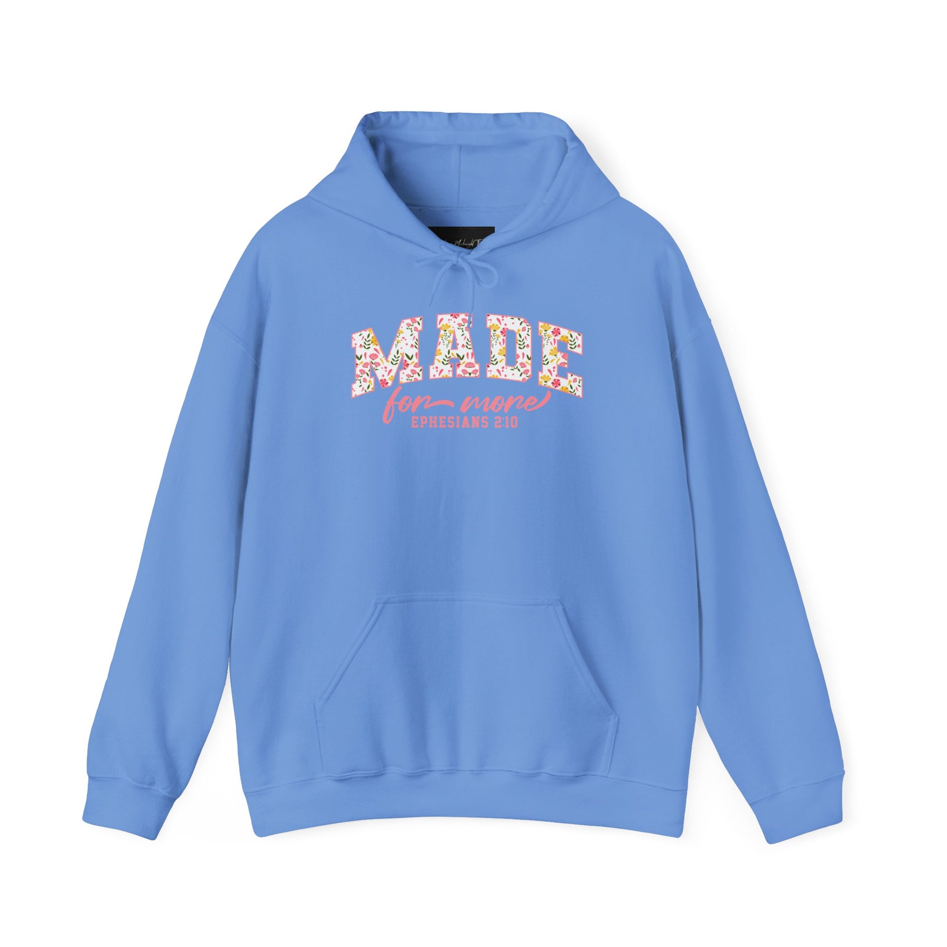 On the front of this custom Christian hoodie is the bible verse the says Made for more Ephesians 2:10, with the word "Made" being large block letters with a pink floral pattern inside the letters, all the other words are in a light pink color.
