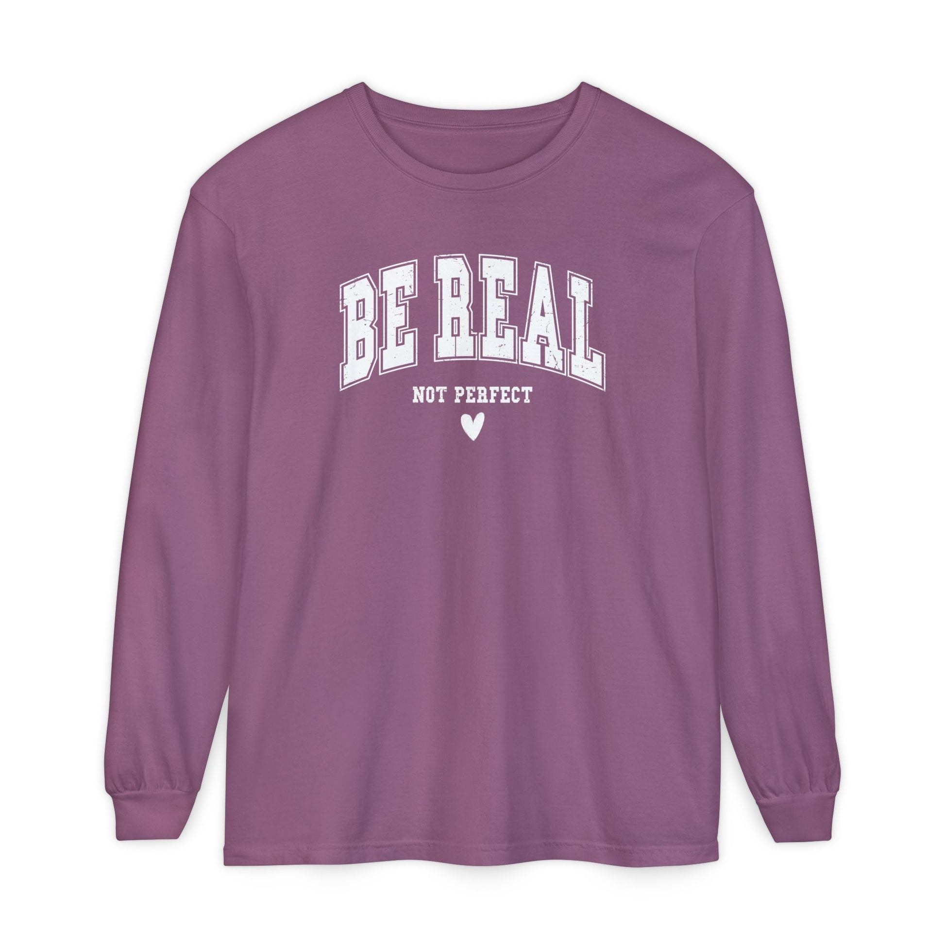 On the front of this custom unisex long sleeve shirt are the words Be Real in large bubble font with the words not perfect underneath the bubble letters, on the bottom there is a heart.