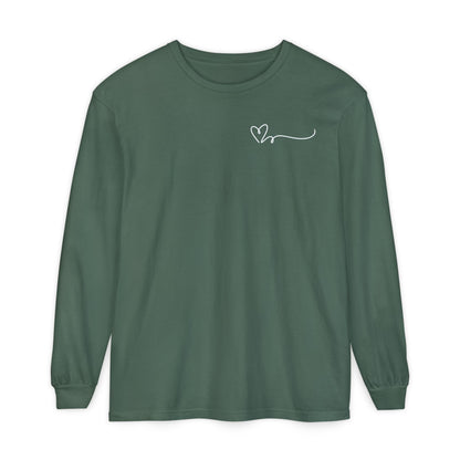 On the top right chest of this custom long sleeve t-shirt is a heart with a trail behind it signifying a heartbeat that you would see on a heart monitor. Perfect for health care workers and teachers.
