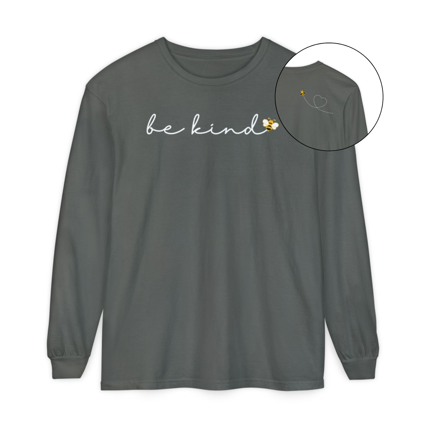 On the front of this custom unisex long sleeve shirt are the words be kind in a simple cursive font, with a bumble bee on the right side of the letter kind, on the back right shoulder there is an image of a bumble bee flying and leaving a trail behind it in the shape of a heart.
