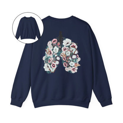 On the back of this women's pullover sweatshirt is an image of a set of lungs, but the lungs are made out of vines with pink and white flowers all over them, there are butterflies sitting in top of the flowers that are light blue in color.