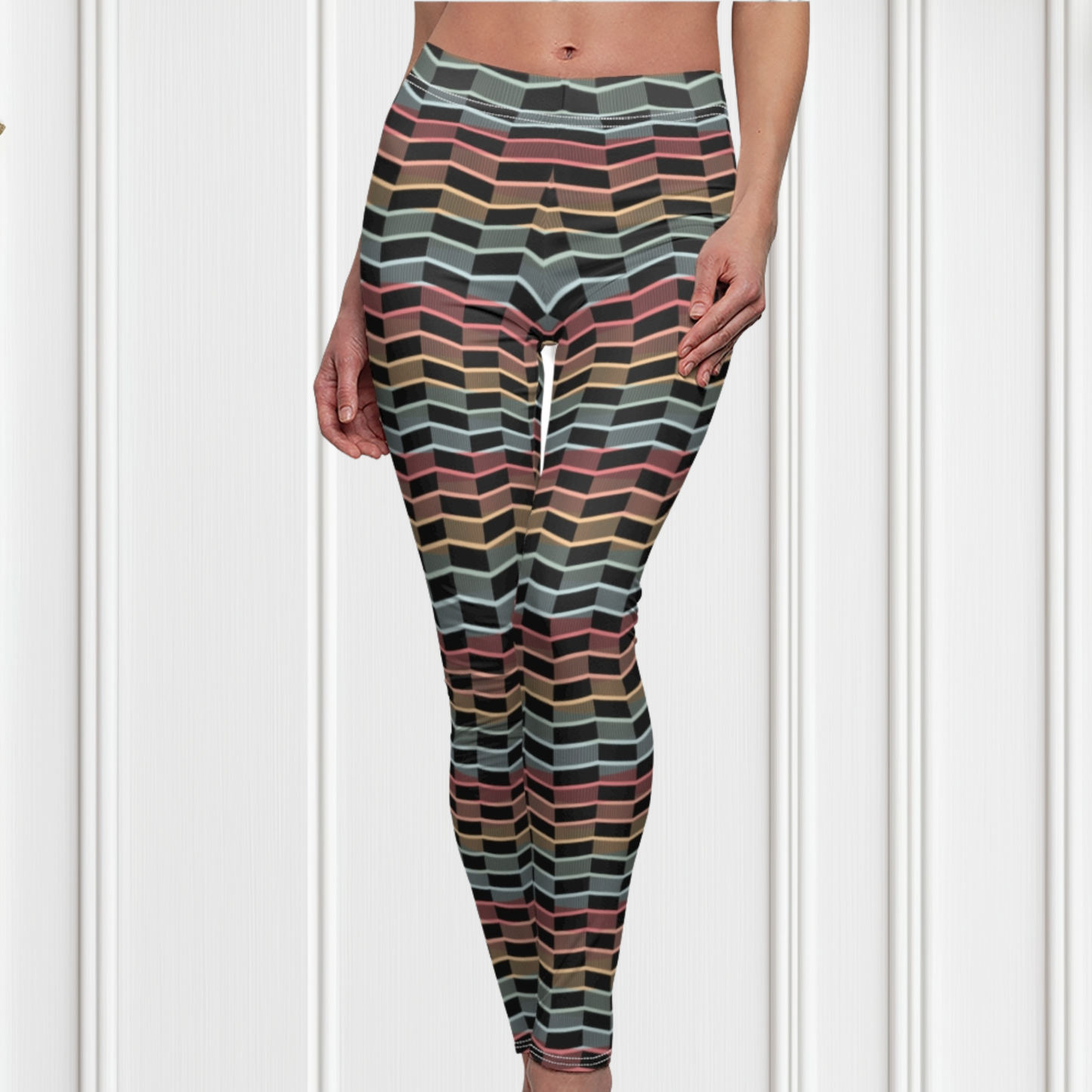 Custom women's leggings with rows of pastel red, yellow and blue from the top to the bottom of the leggings, there is a black abstract pattern overtop of the colors giving the leggings a 3D look.