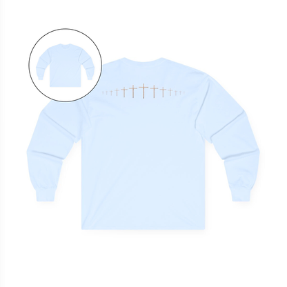 On the back of this light blue colored Christian long sleeve shirt is a large wooden Jesus cross in between the shoulder blades, the Jesus cross then keeps getting smaller and smaller till it fades right off the shirt giving it a amazing 3D look on the back.