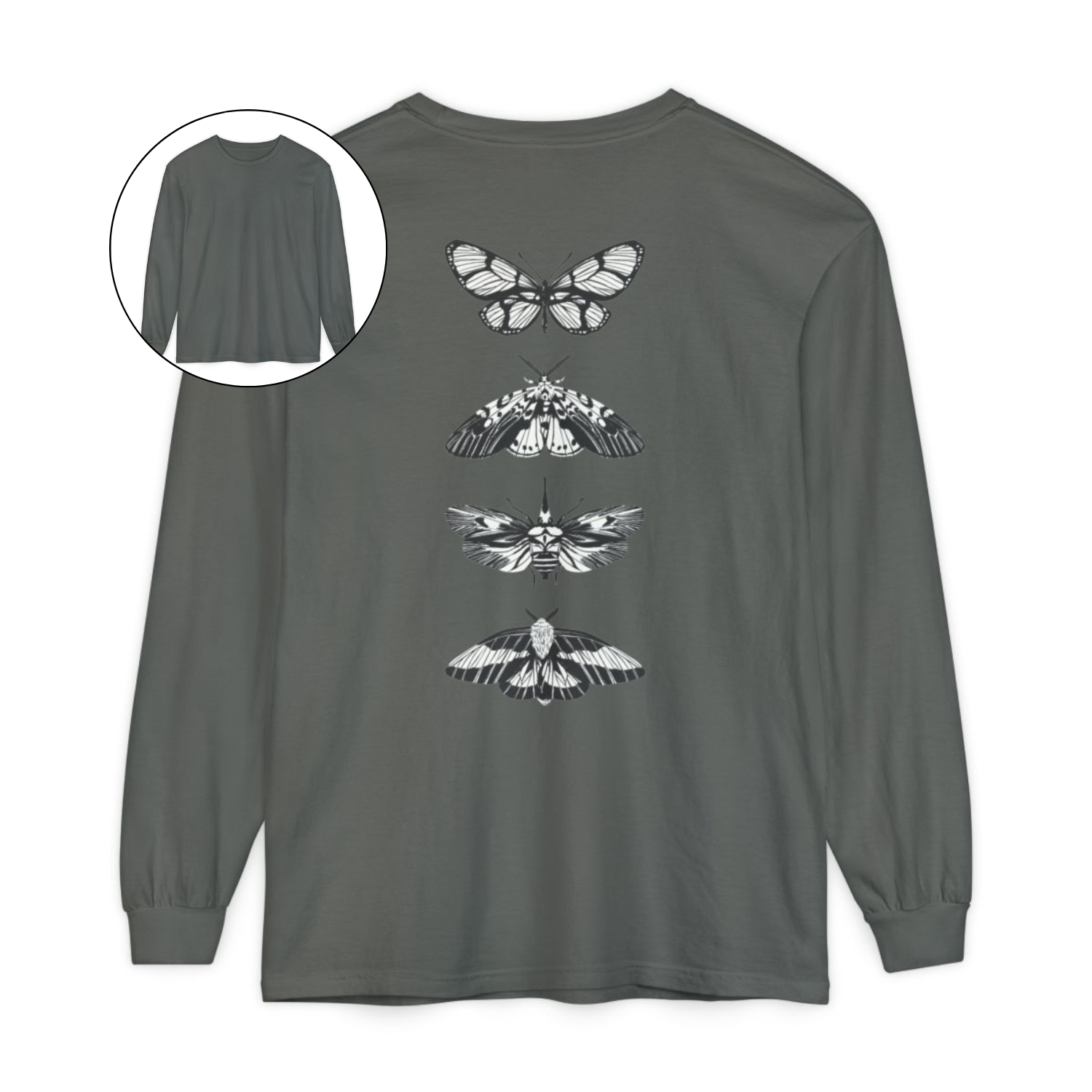 On the back of this long sleeve women's shirt right in between the shoulder blades is a row of black and white butterflies, starting at the top of the back and headed to the bottom of the shirt.