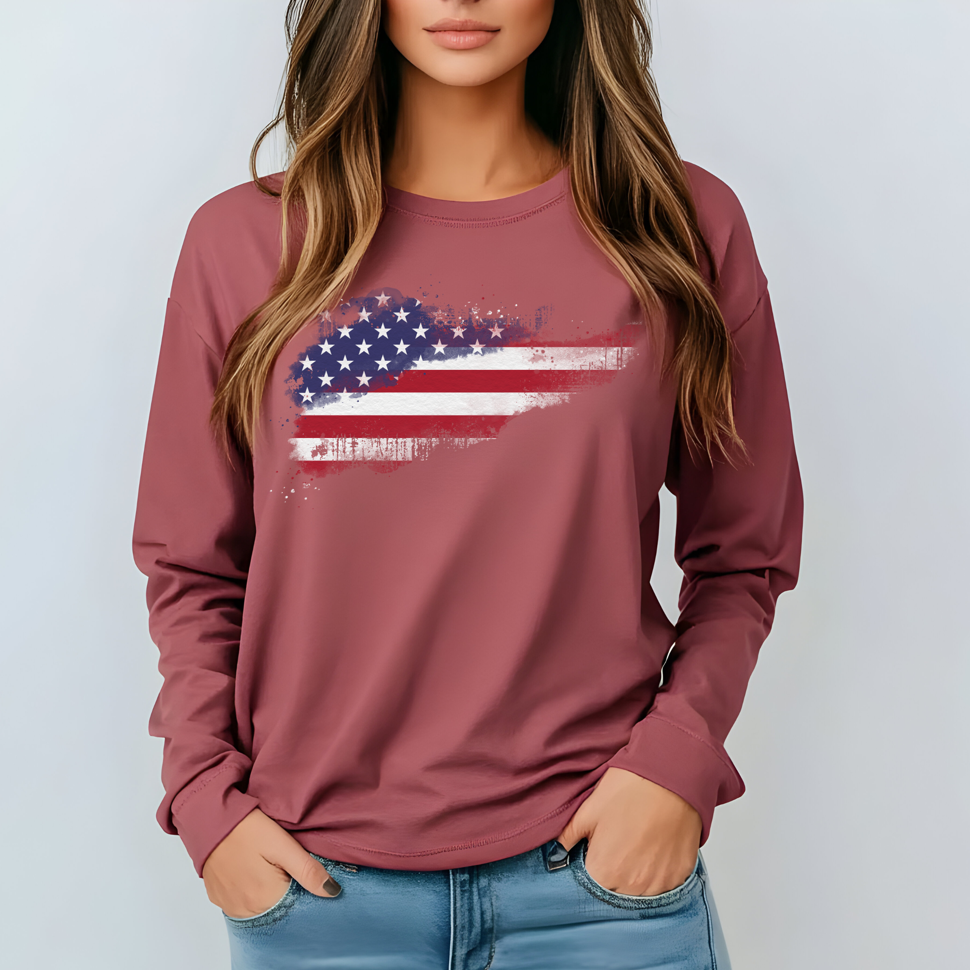On the front of this super soft unisex long sleeve t-shirt is a vintage image of the United States of America Flag that looks like it has been scratched onto the shirt, this long sleeve tee is perfect for the 4th of July and patriotic individuals.