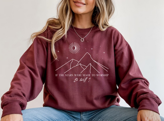 On the front of this Christian sweater is an image of mountains with a bunch of stars on the top, the words If the stars were made to worship So will i in two different fonts.